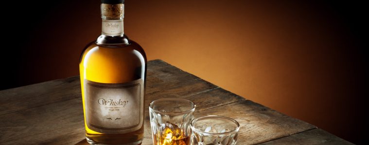 A fifth of whiskey and two glasses